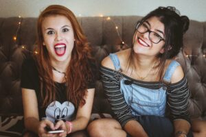 parenting young adult children happyyoung women sitting on couch