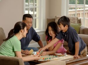 family mental health family playing a board game